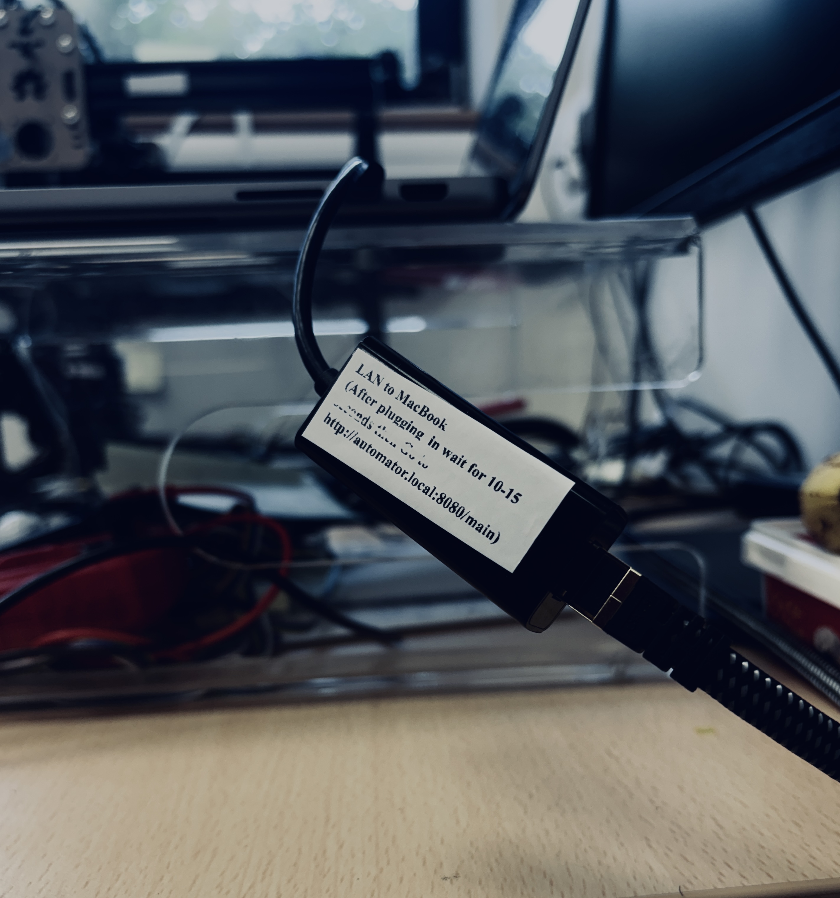 MacBook connected to the Automator by Ethernet cable via a USB-C to Ethernet adapter