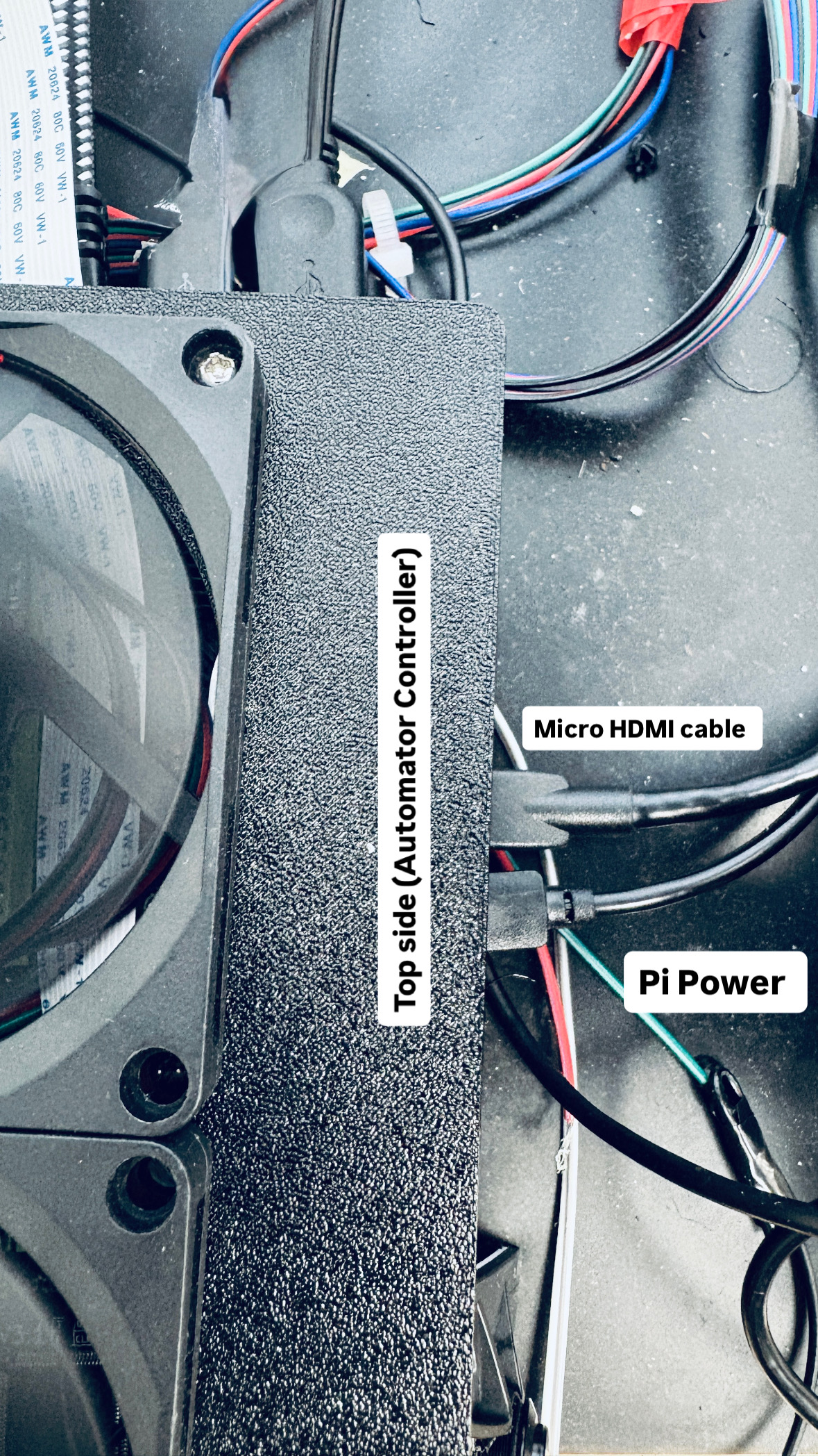 Micro HDMI cable and Pi power connections on the top of the Automator controller enclosure