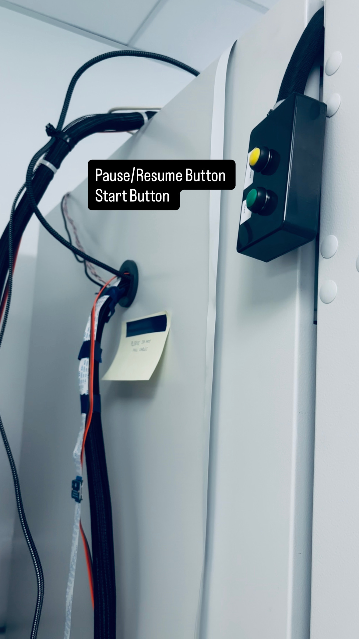 Pause/Resume (yellow) and Start (green) physical buttons on the side wall of TSL PGC07